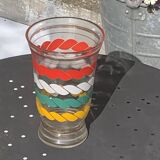 Vase en verre transparent et dore et lignes sérigraphies rouge, blanc, vert et jaune vintage 1960