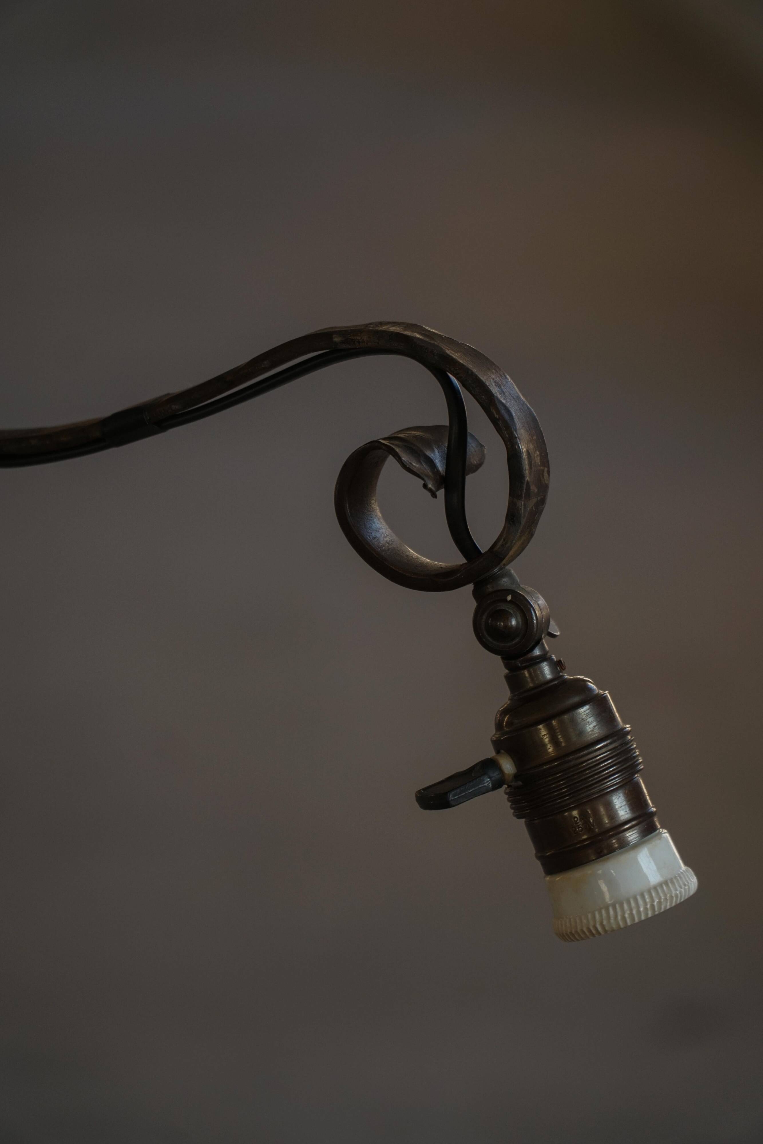 20th-century wrought iron floor lamp with swirling detail, Danish Art Deco.