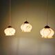 Trio of Art Deco marbled opaline pendant lights, 1920-30
