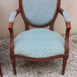 Paire de fauteuils médaillon style Louis XVI