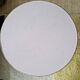 Round soft pink rattan table
