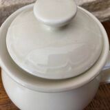 Small light beige earthenware teapot