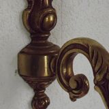 Simple wall sconce in classic Empire style in vintage French bronze.