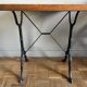 Superb square table made of solid oak from the 1960s, with a cast iron bistro base.
