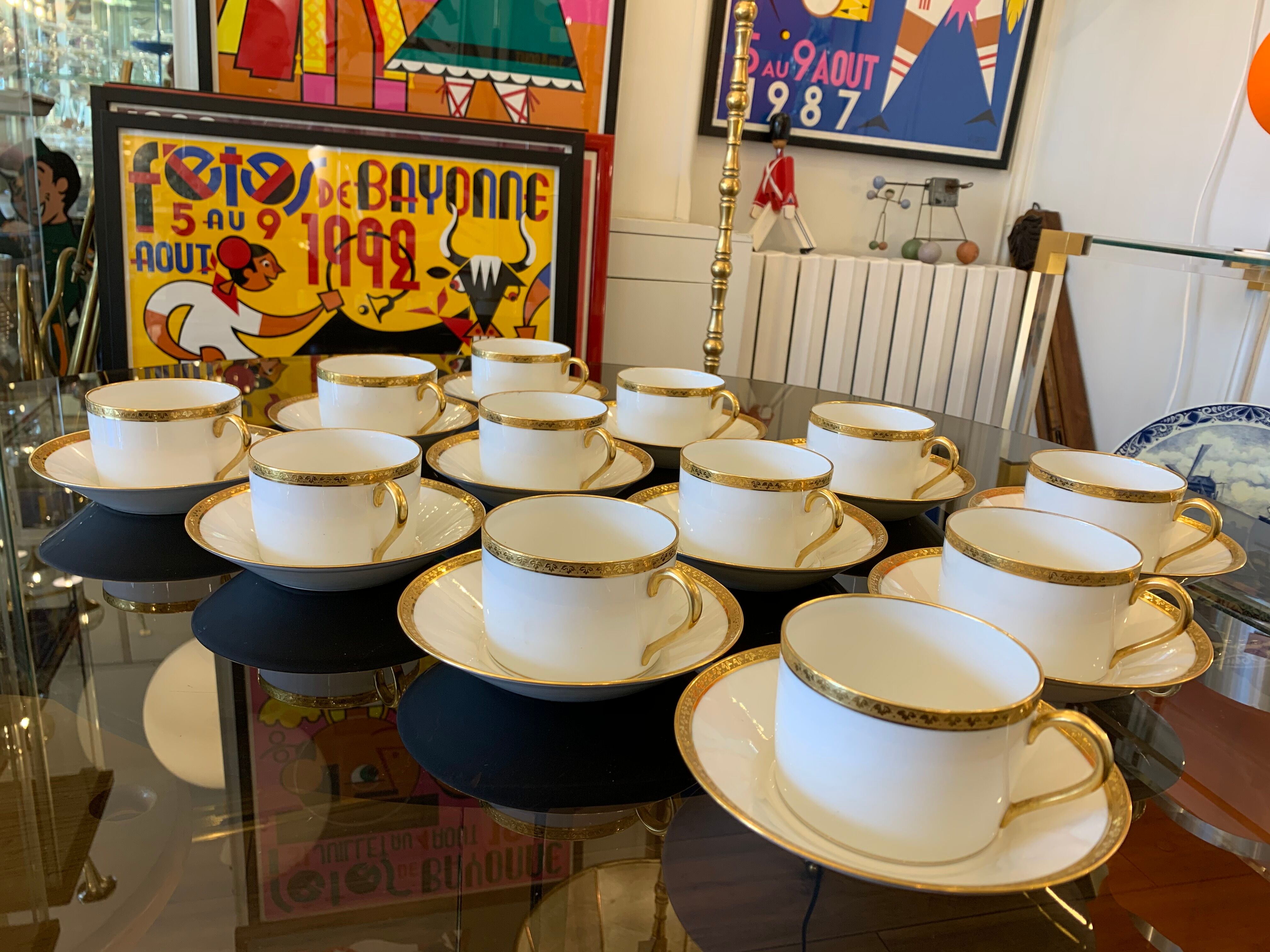 12 coffee cups and 12 white porcelain cups of Gold Gold Limoges