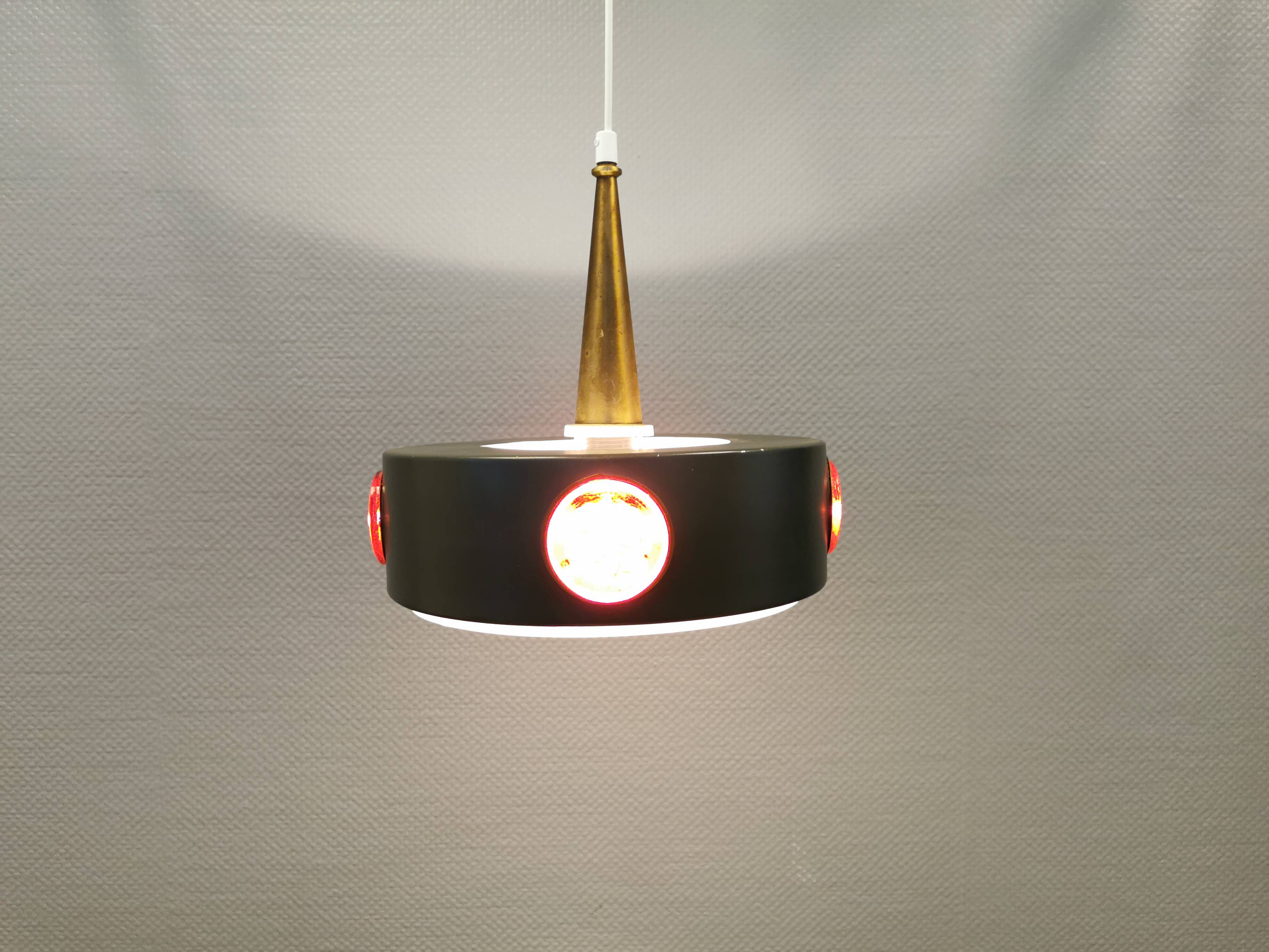 Swedish hanging lamp, in dark green lacquered metal with red glass prisms and brass top/suspension.