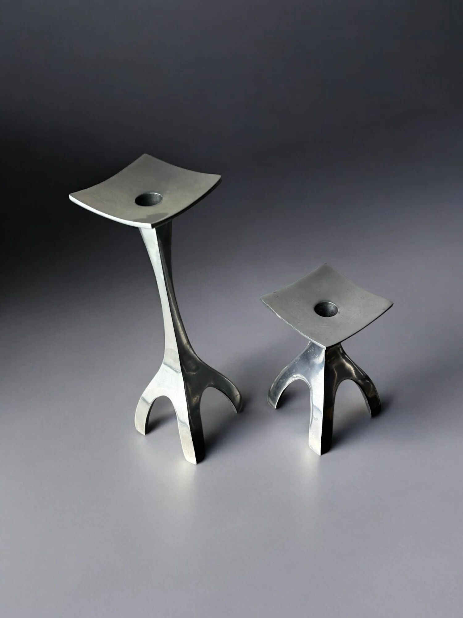 Pair of biomorphic candleholders, solid aluminium, Spain, 1970s