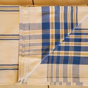 Cotton tablecloth for 12 place settings with napkins.