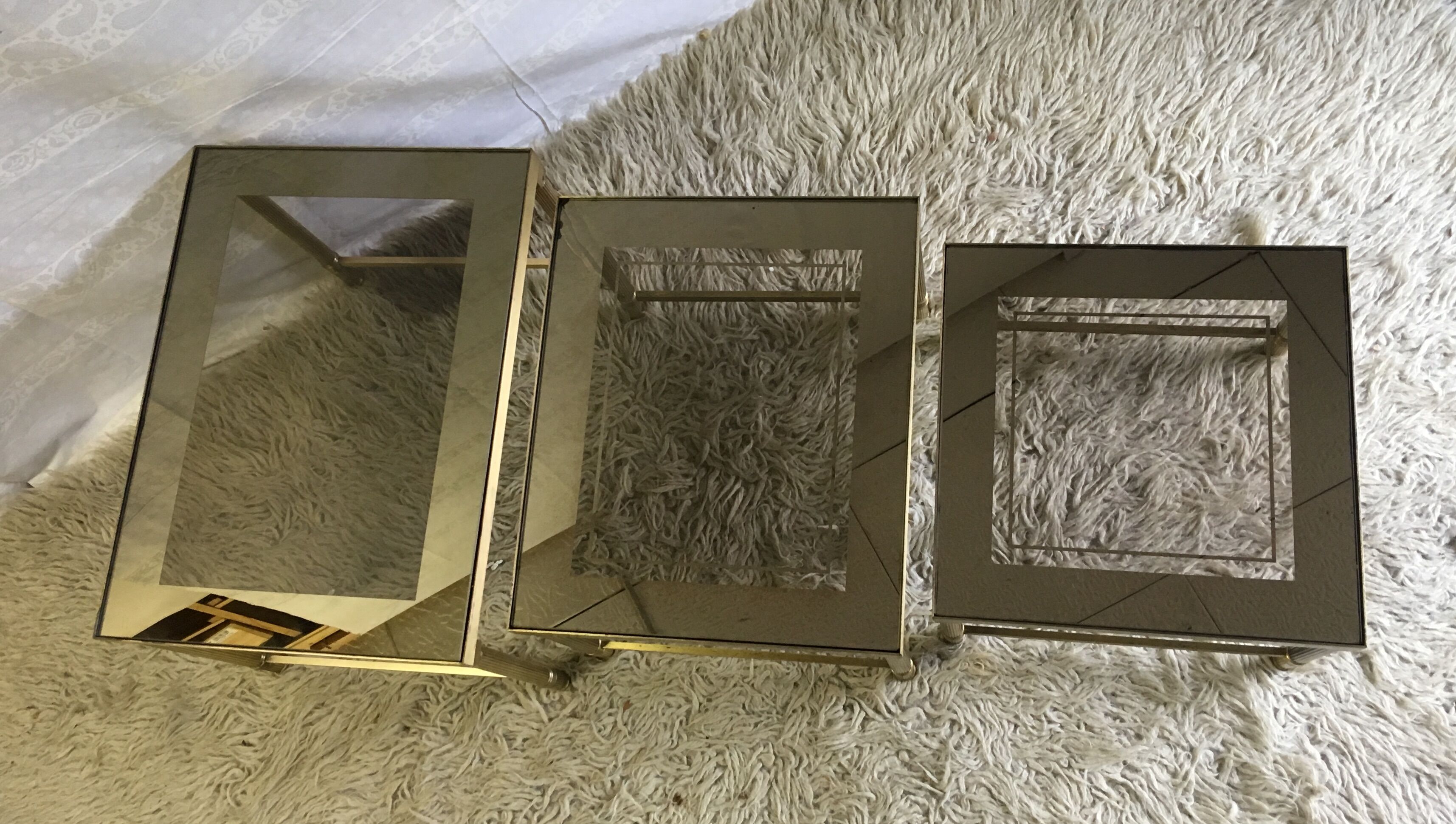 Brass and glass pull out tables 70