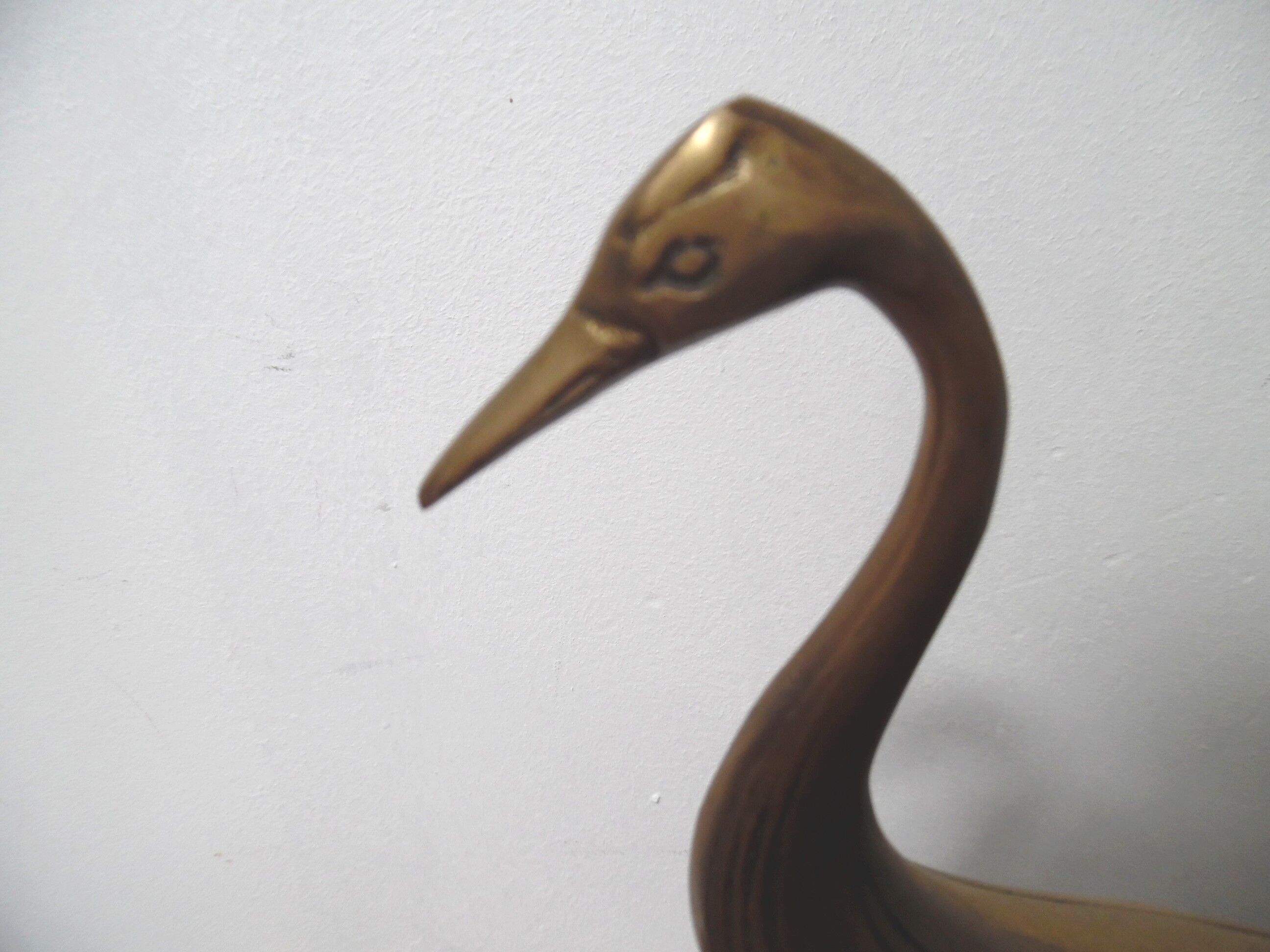 Brass heron standing