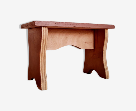 Old bench in garnet pink wood