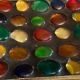Square section cut glass and metal decorated with multicolored glass cabochons