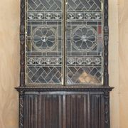 Jacobean hardwood library with carved panels and glass doors.