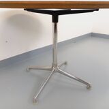 Vintage Eames round table for Vitra in white melamine, wood, and metal.