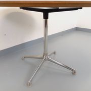Vintage Eames round table for Vitra in white melamine, wood, and metal.