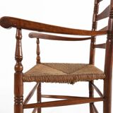 Antique wooden armchair with cane seat, France ca. 1900