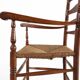Antique wooden armchair with cane seat, France ca. 1900