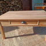 Low farmhouse table in raw wood