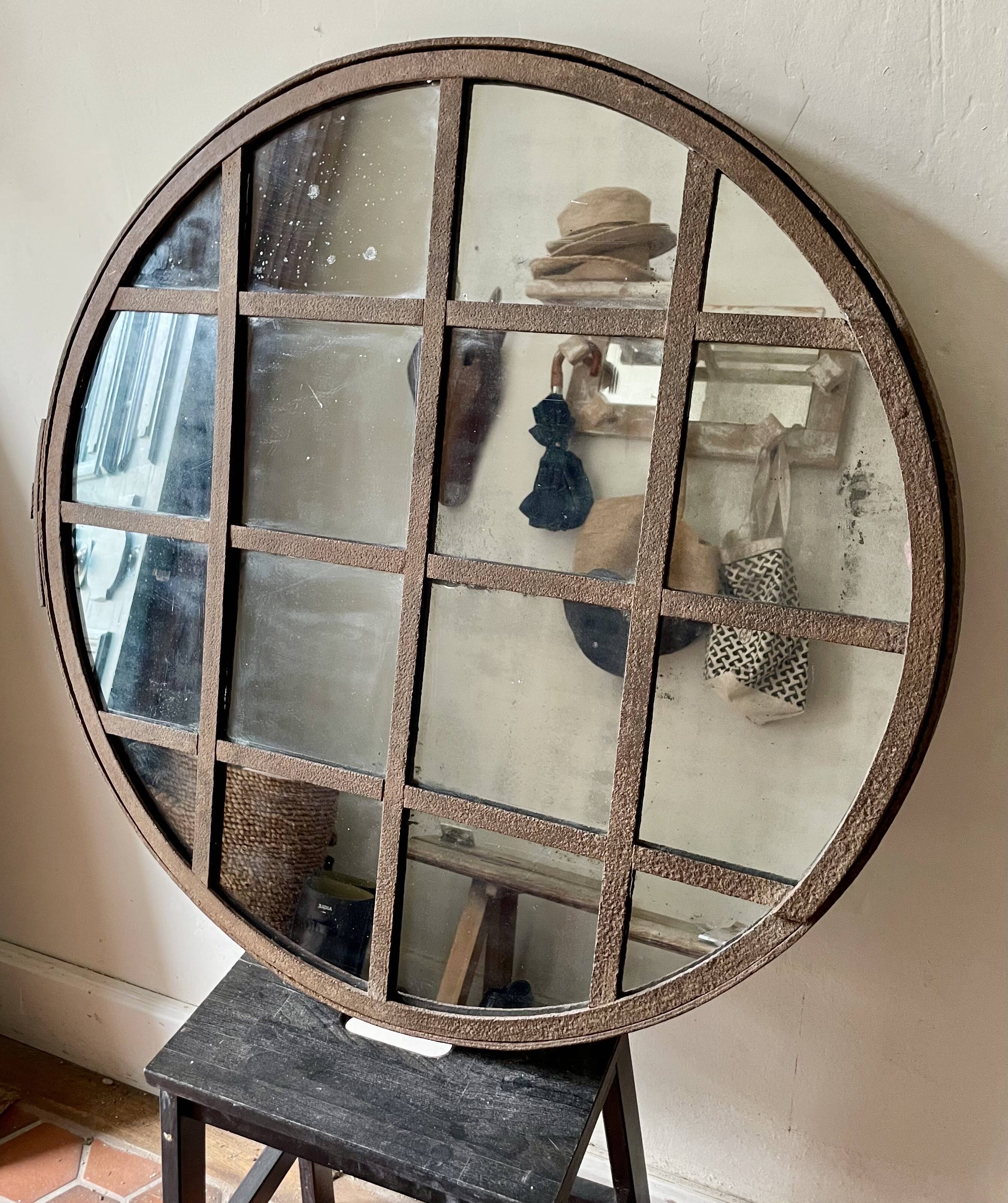Round mirror mounted in mild steel