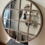 Round mirror mounted in mild steel