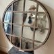 Miroir rond monté dans du fer doux