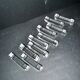 Set of 10 designer crystal knife rests, minimalist style