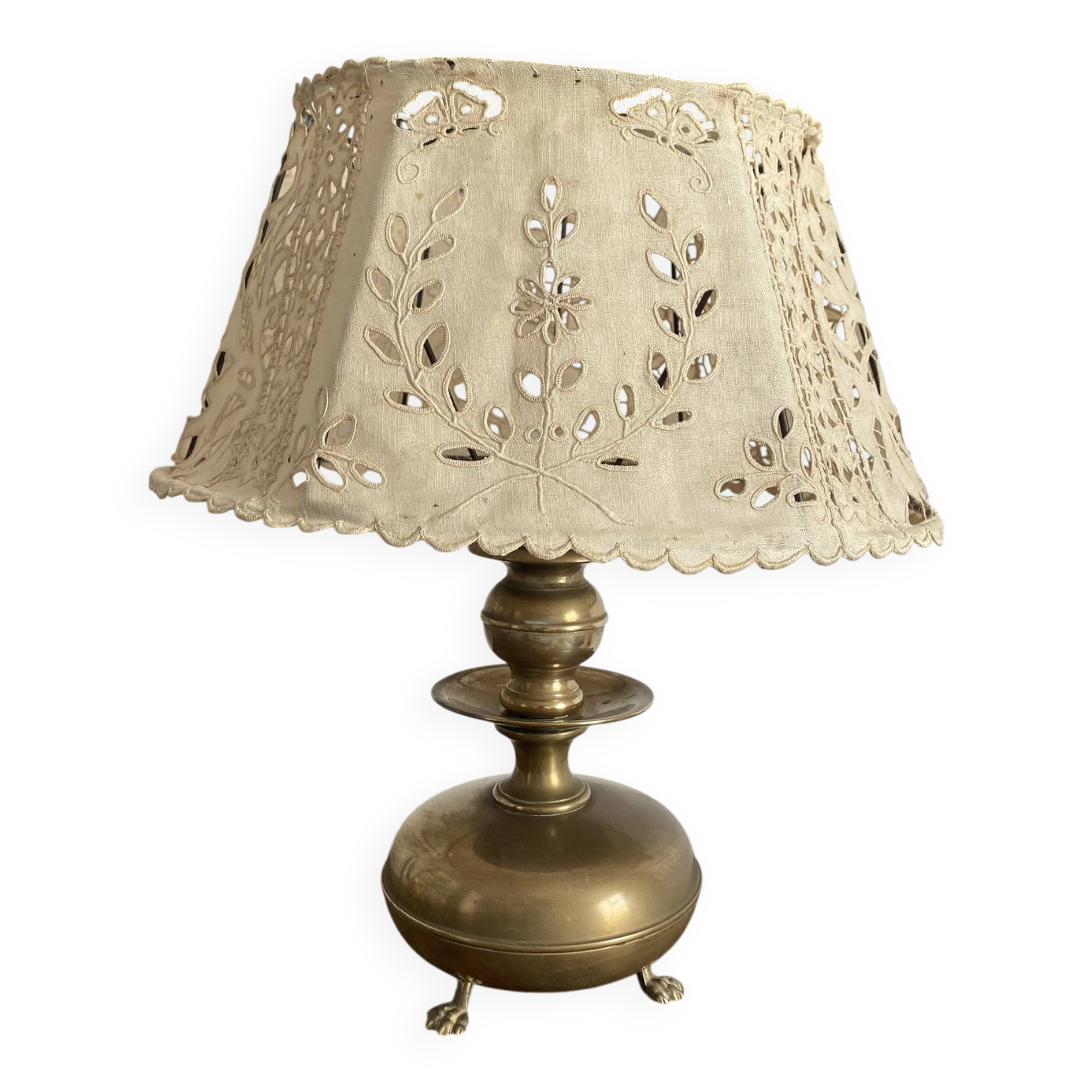 Antique brass lamp with embroidered openwork shade.