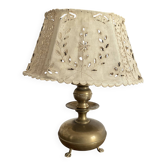 Antique brass lamp with embroidered openwork shade.