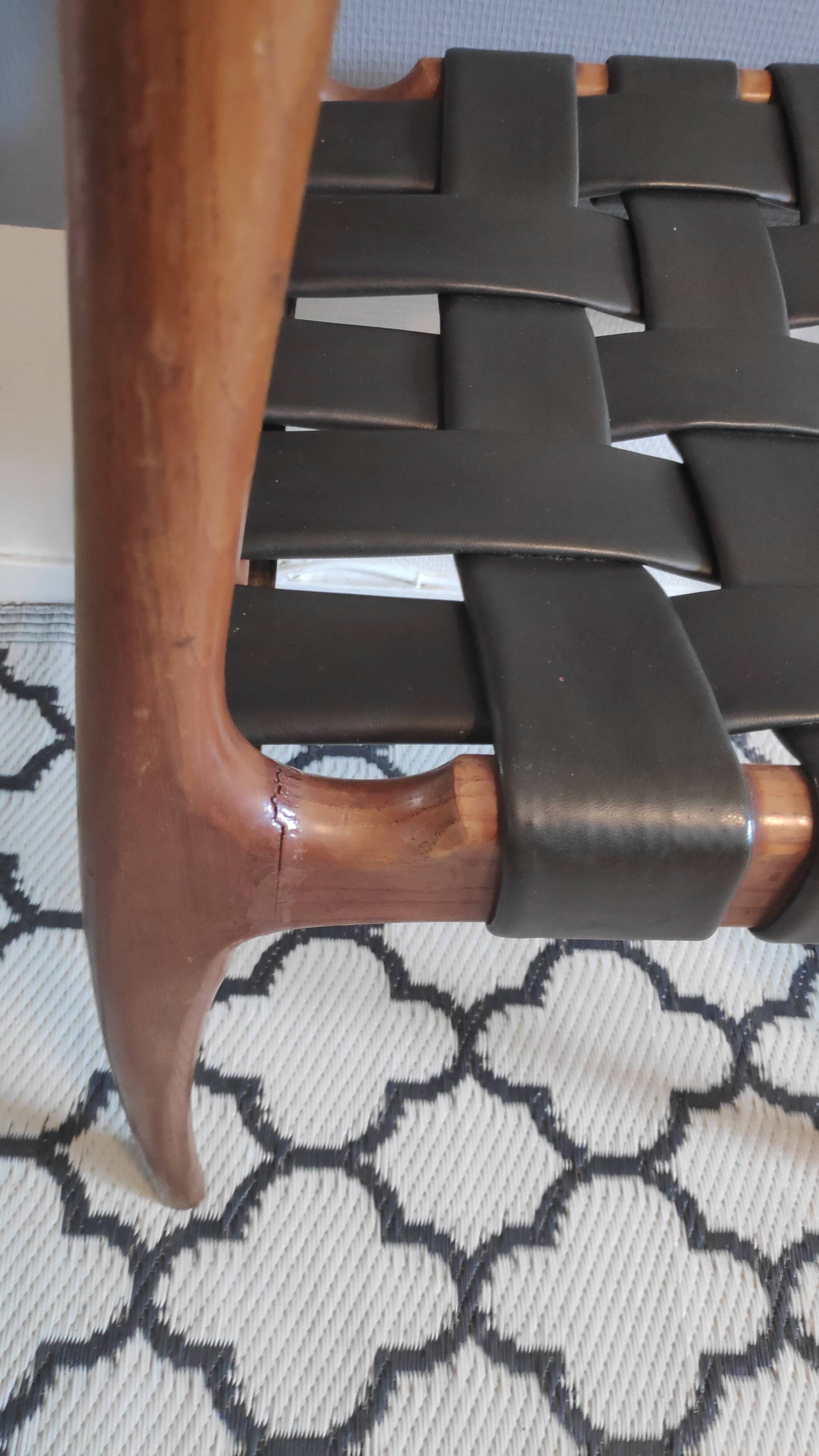 chair wooden structure and sitting with braiding of black skai strips