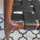 chair wooden structure and sitting with braiding of black skai strips