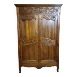 Louis XV period wardrobe façade, solid wood architectural elements, richly carved.