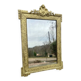 19th-century antique mirror in carved gilded wood, Napoleon style.