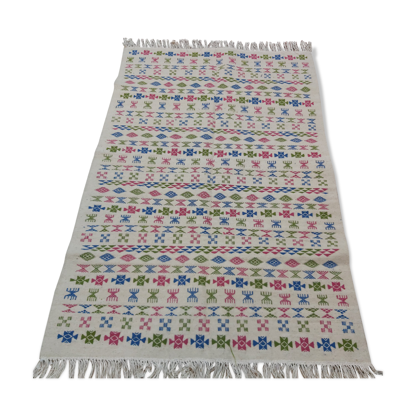 White carpet with Berber motifs pink green and blue
