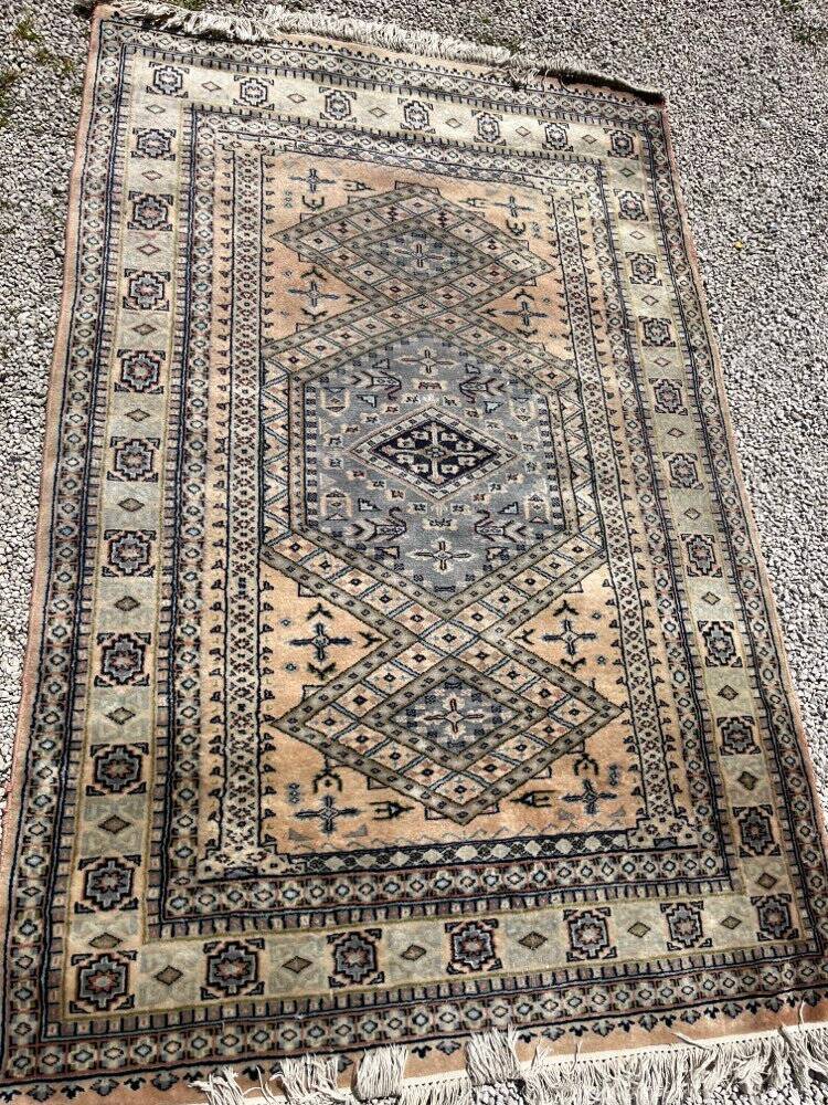 Antique Persian carpet made of wool.