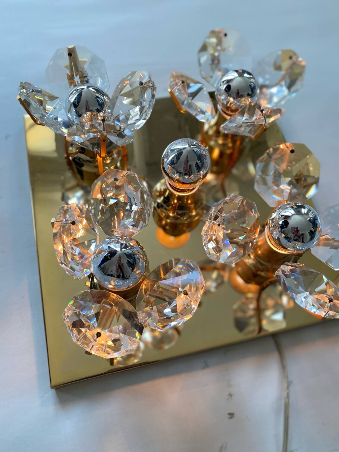 Brass wall lamp with glass prisms
