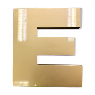 Golden sign letter E