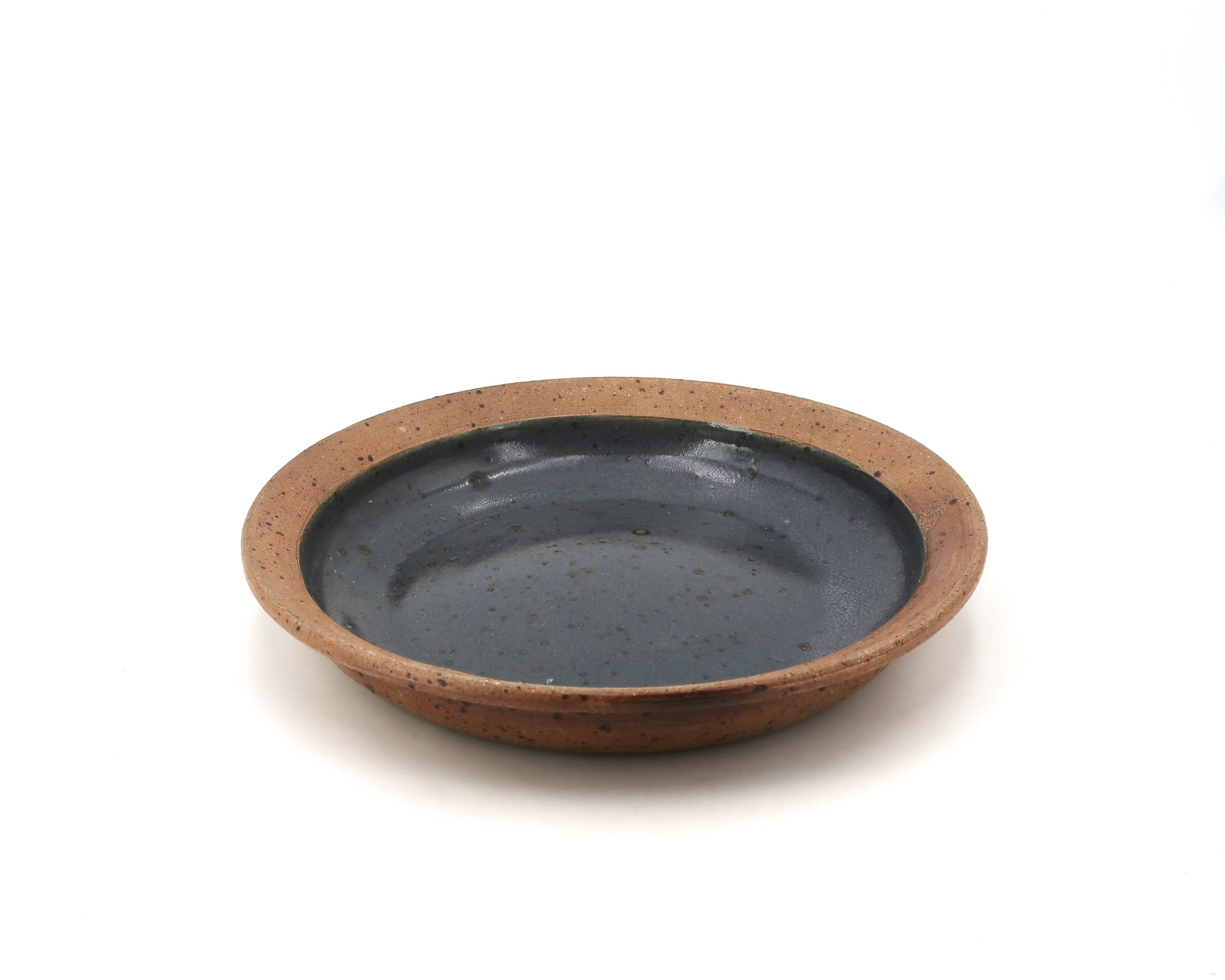 Round hollow plate in stoneware by Pierre Digan, La Borne, blue ceramic from the 1960s.