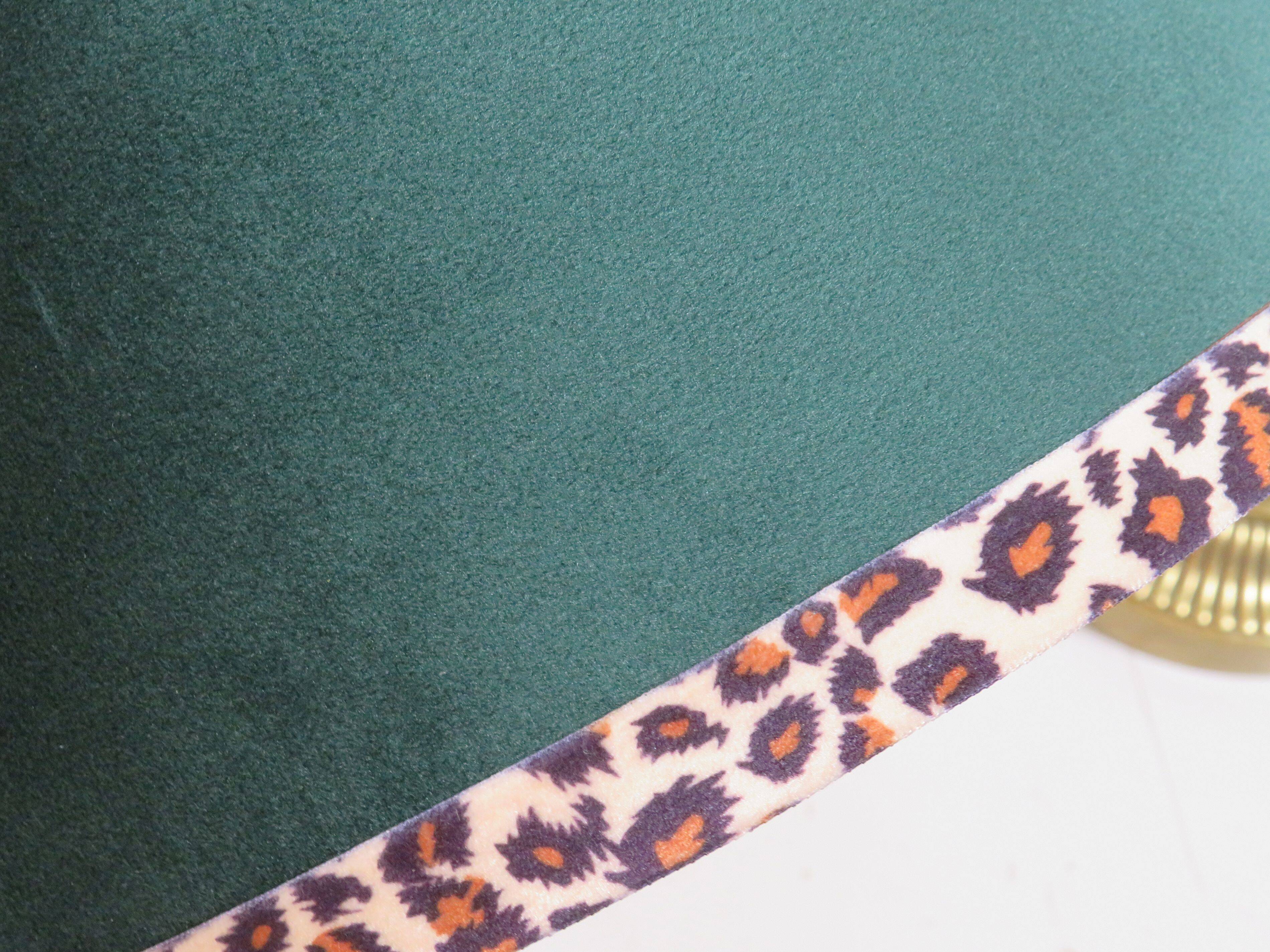 Vintage brass table lamp with green velvet shade.