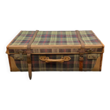 Old large suitcase in leather and tartan fabric