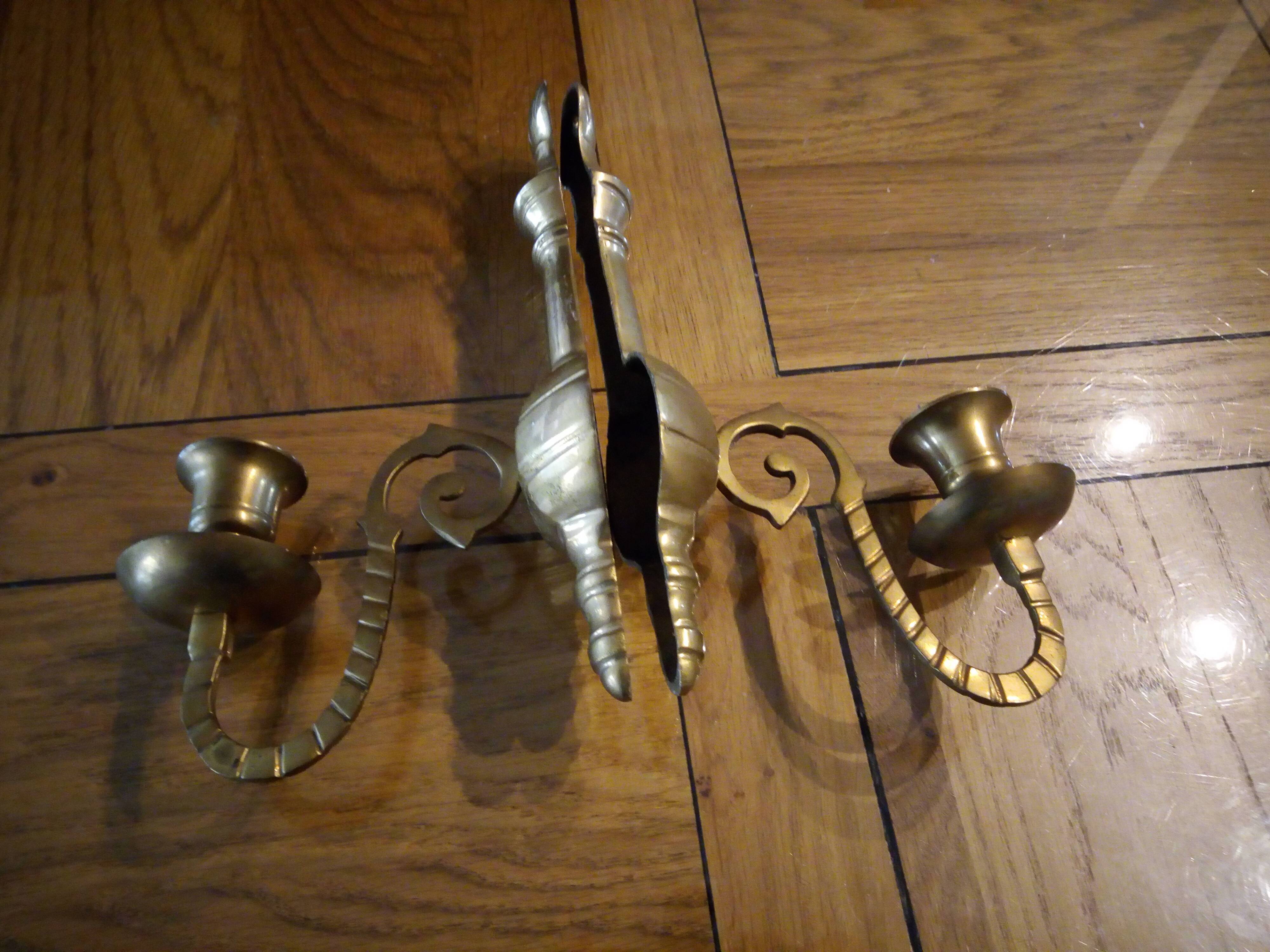 Two candlestick sconces