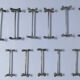 Eleven 70s design metal "crosshair" knife holders