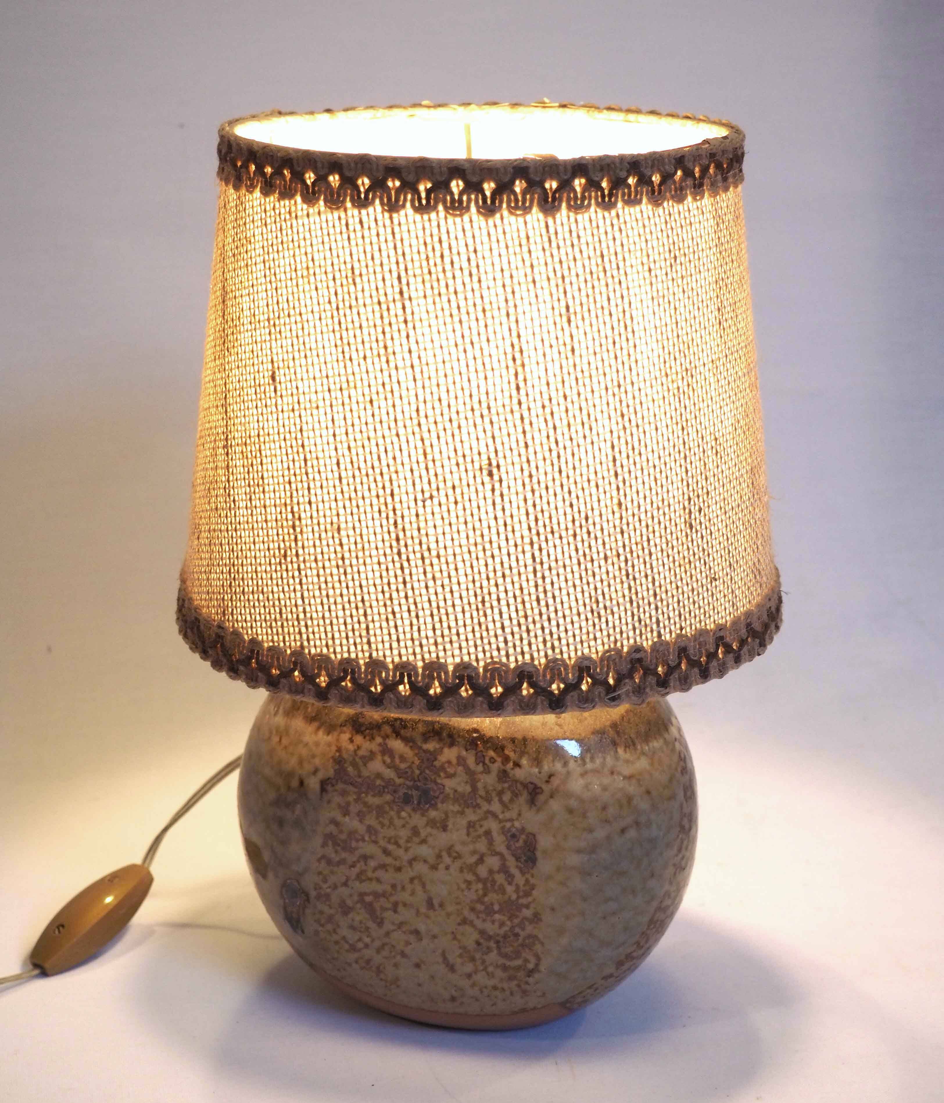 Flattened ball ceramic lamp
