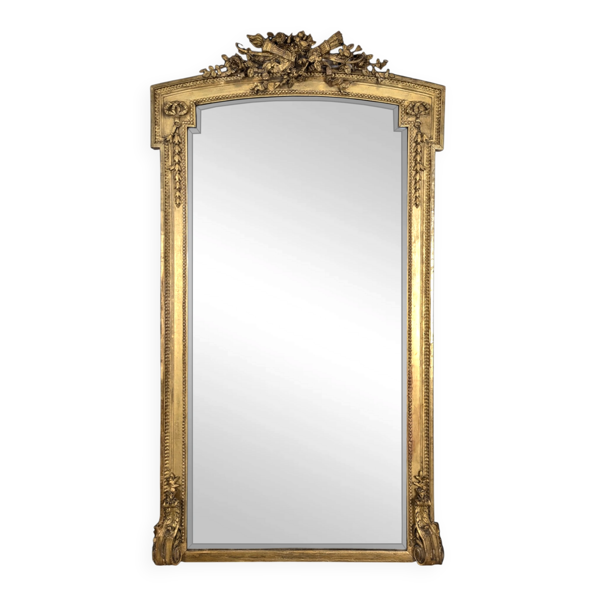 Large gilded wooden mirror in Louis XVI style from the late 19th century.