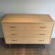 Eggshell lacquered chest of drawers with brushed steel legs. In the style of Knoll.