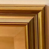 Beveled mirror with gold borders