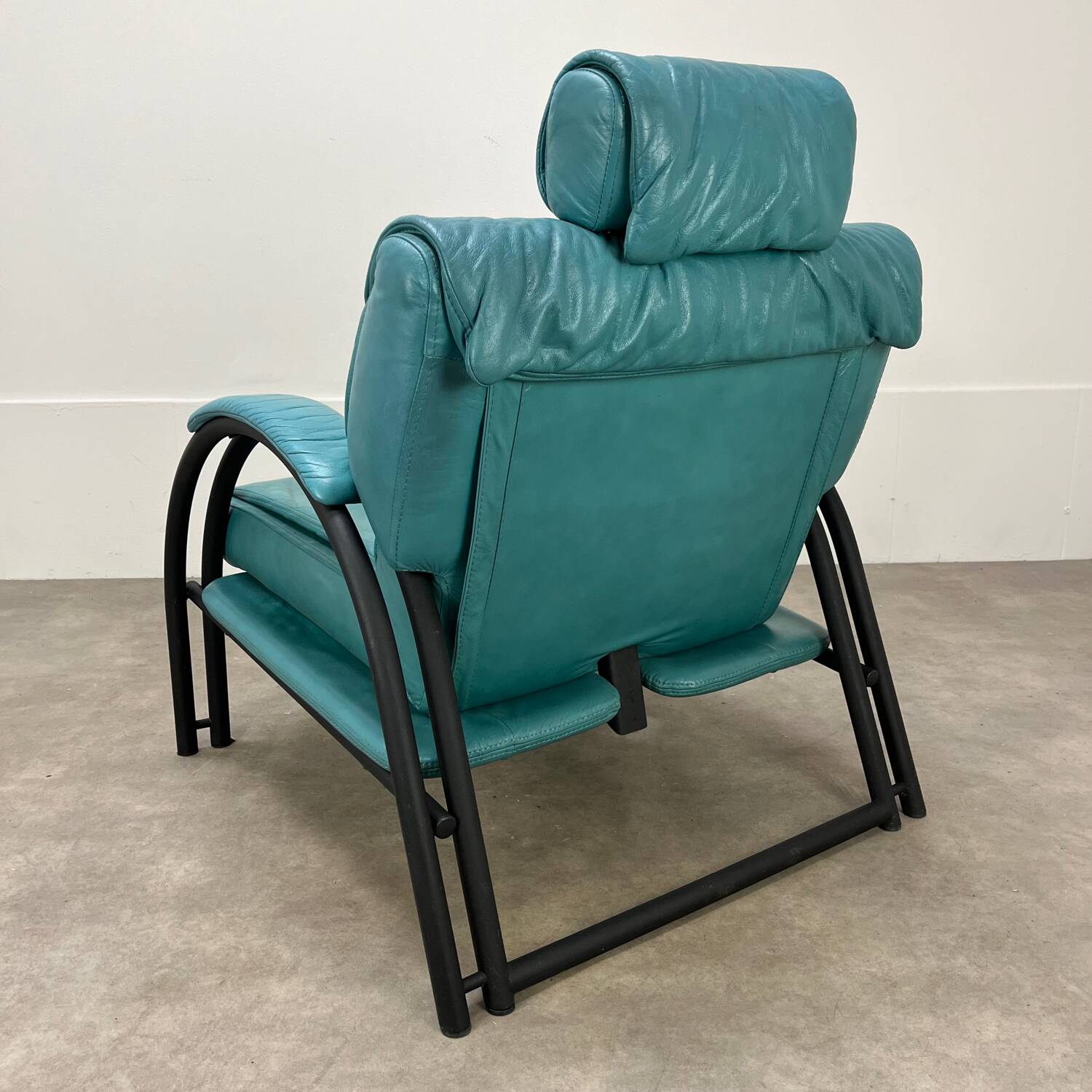 Postmodern design armchair and ottoman, 80s leather