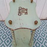 Shelf coils monogrammed patinated wood