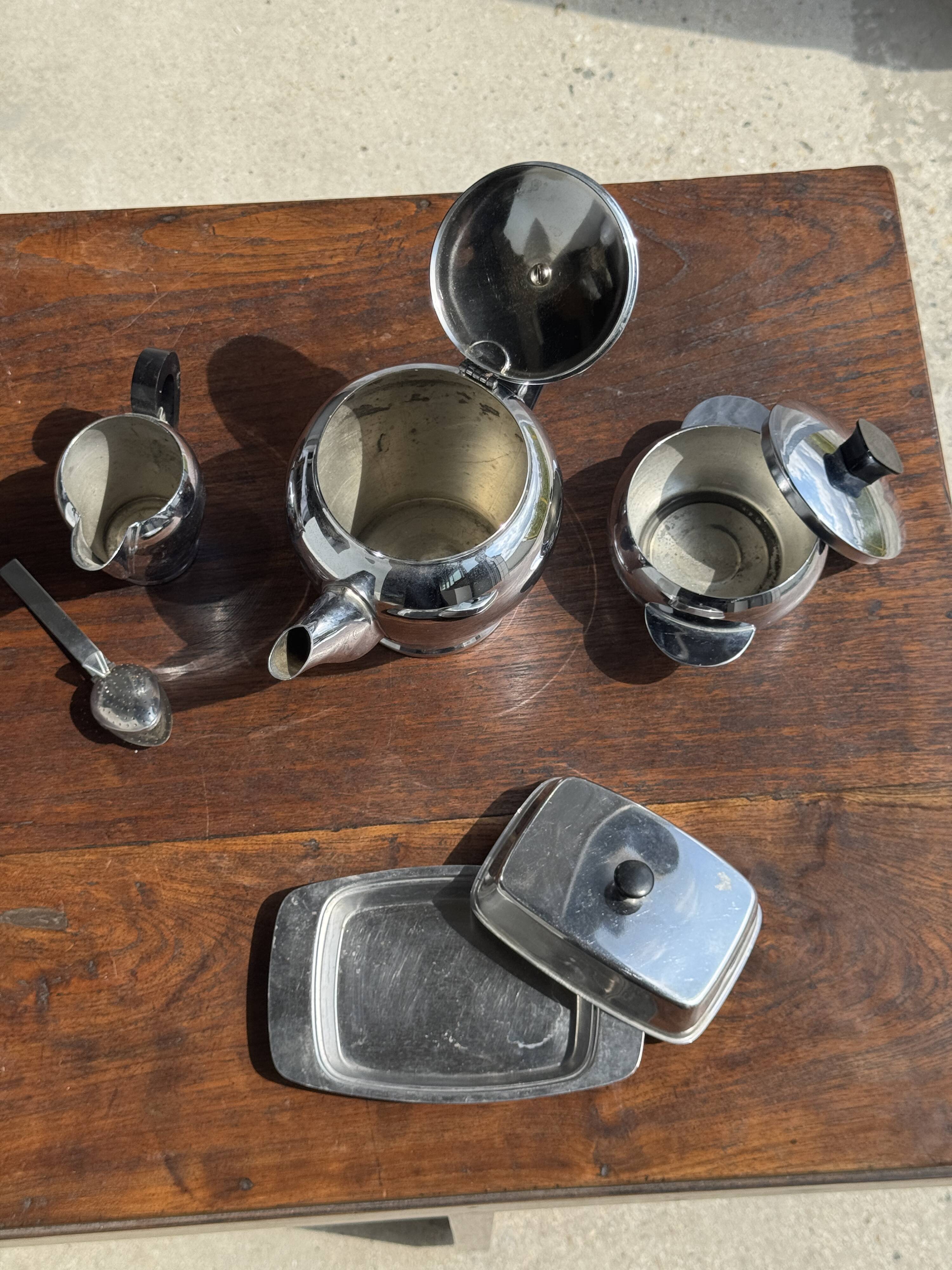 Tea set including teapot, milk jug, sugar bowl and butter dish