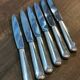6 large silver metal knives