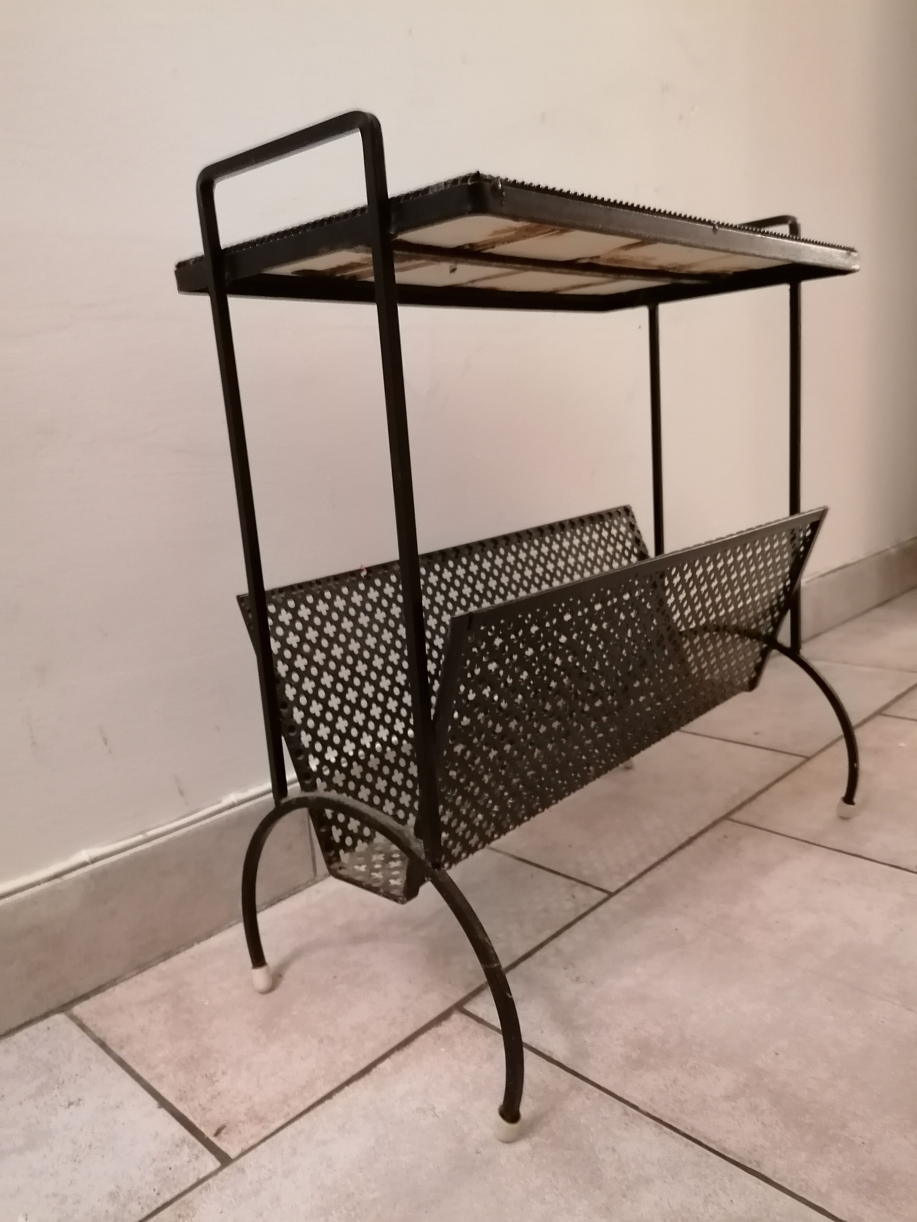 Table carries steel magazines perforated sheet metal vintage ceramic checkerboard